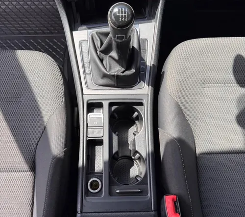 Car centre console after deep clean — spotless trim and cupholders