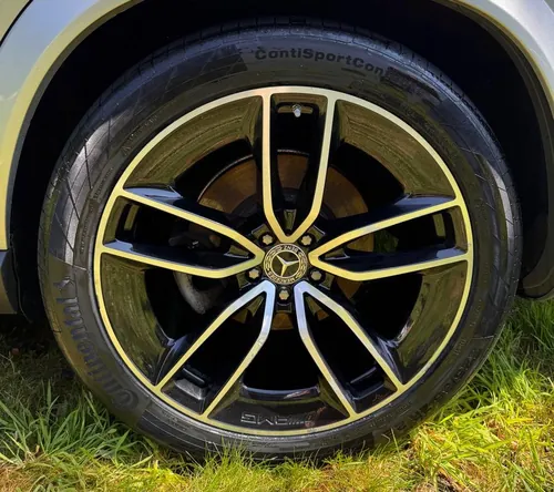 Mercedes alloy wheel after detailing — clean gloss finish
