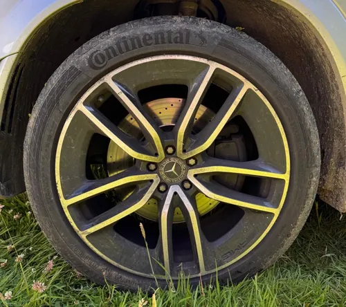 Mercedes alloy wheel before detailing — brake dust and road grime